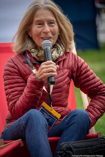 Author Bernadette McDonald smiling and speaking into a microphone
